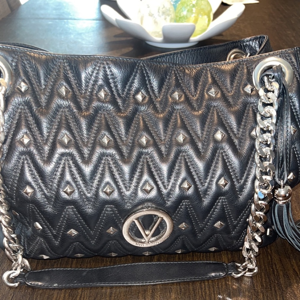 Authentic black Valentino bag with Silver hold  hardware. Used once in great bag